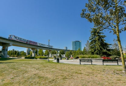 Sky train overlooking a park in the Surrey, BC city centre